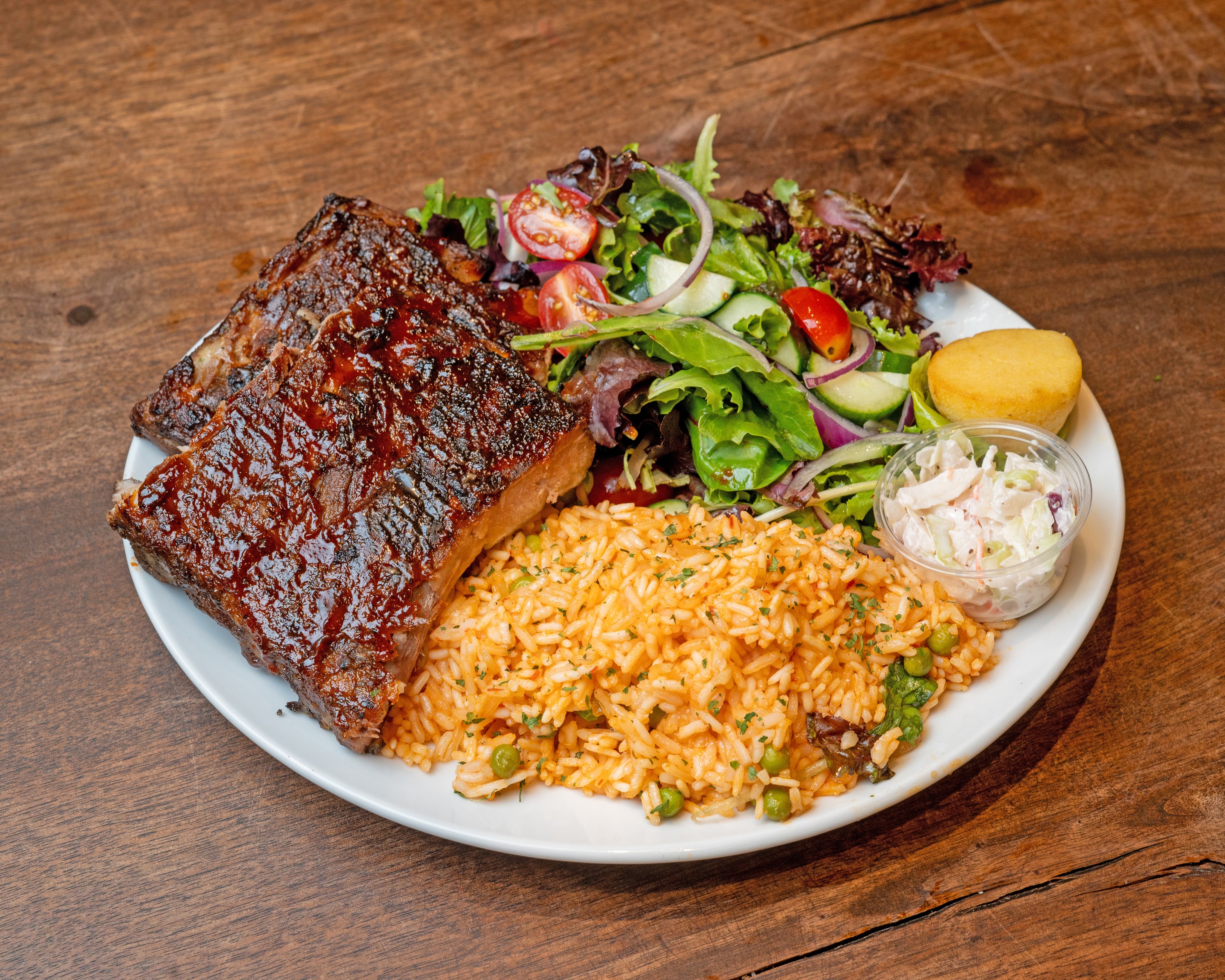 BRAVA fire-grilled chicken dinner with rice and fresh garden salad